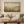 Field of Grace framed wall art hanging above a sofa in a living room