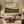 Fields in Motion framed wall art in an antiqued gold frame in a neutral living room