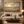 Fields of Peace framed wall art in a dark wood frame above a living room sofa