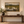 Lowland framed wall art in an entryway above a console table