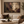 October Nocturne framed wall art in a dark wood frame above a living room sofa