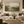 Olive Ground framed wall art in an antiqued gold frame in a neutral living room