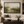 Olive Ground framed wall art in a black frame in a modern living room