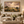 Rolling Country framed wall art in an antiqued gold frame in a neutral living room