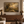 Still He Leads framed wall art above a living room console table