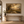 Still He Leads framed wall art in an entryway above a console table