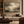 Storm in Stone framed wall art in a dark wood frame above a living room sofa