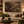 The Forgotten Garden framed wall art in an antiqued gold frame in a neutral living room