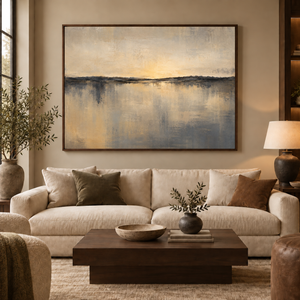 The Great Divide framed wall art in a dark wood frame above a living room sofa