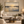 The Great Divide framed wall art in an antiqued gold frame in a neutral living room