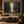 The Narrow Way framed wall art in a dark wood frame above a living room sofa