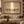 The Quiet Light framed wall art in a dark wood frame above a living room sofa