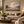 The Shepherd and His Flock framed wall art in an antiqued gold frame in a neutral living room