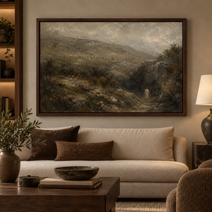 Through the Valley framed wall art in a dark wood frame above a living room sofa