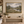 Wool Pastures framed wall art in an antiqued gold frame in a neutral living room